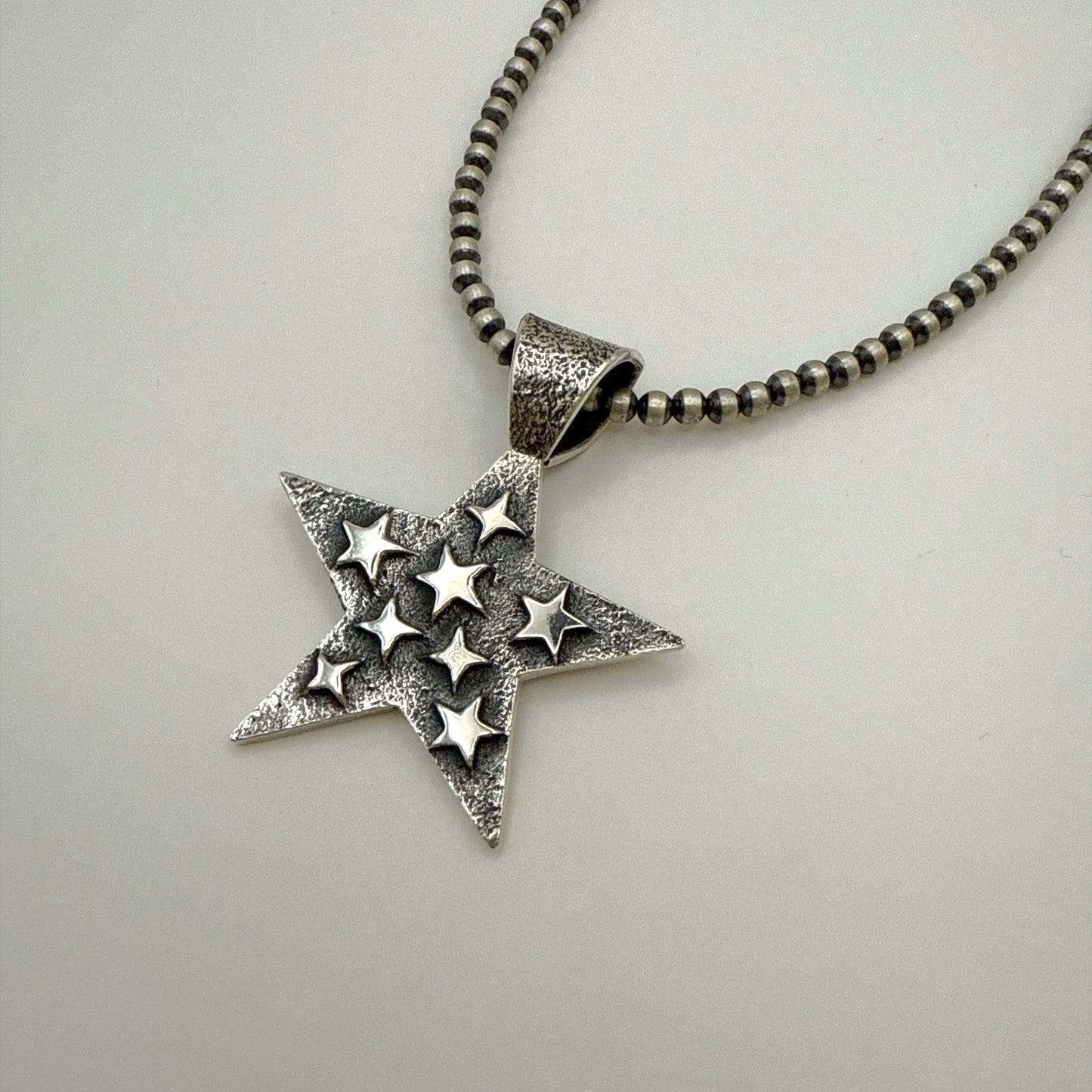 Tufa Cast Star Pendant By Kevin Yazzie